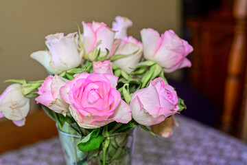 a bouquet of beautiful roses in a vase on the table