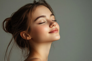 Fototapeta premium A close up of a girl's face with her eyes closed