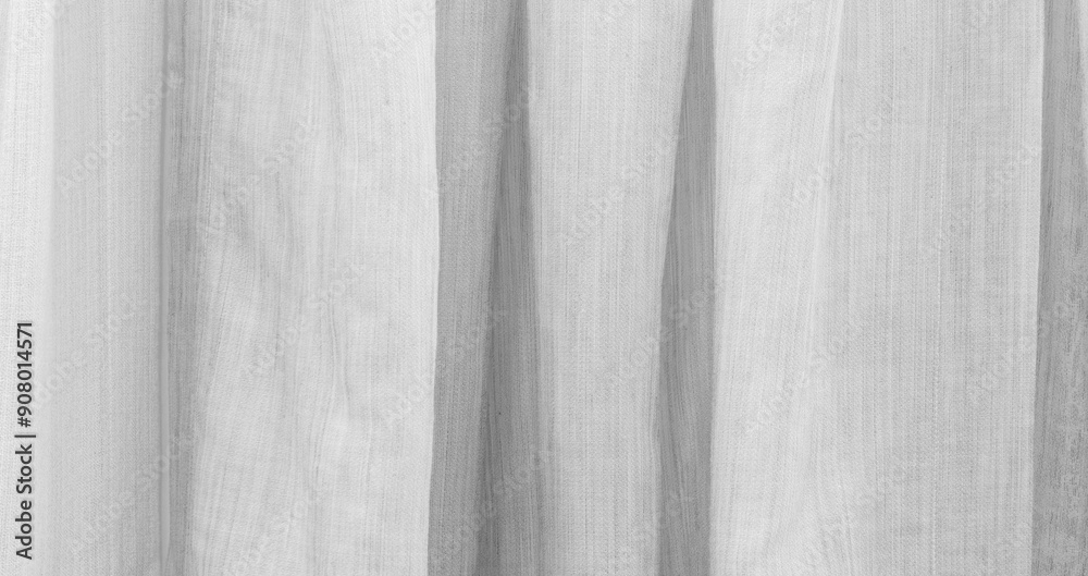 Poster white textured material with wood grain pattern as background.