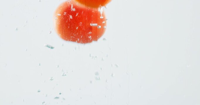 Fruit, orange and vitamin c with water splash for diet, nutrition or fresh produce in studio on a white background. Closeup of juicy, citric acid or hydration of natural organic food on healthy detox