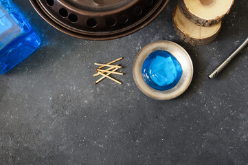 Chafing fuel gel poured into metal dish with matchsticks, blue chafer gel, reso