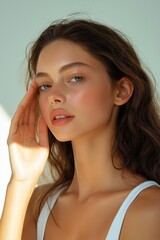 Portrait of a beautiful young woman with clean fresh skin, natural make-up.