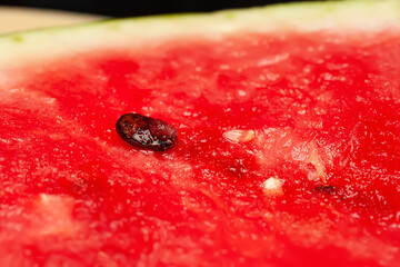 Watermelon pulp. Texture of the pulp of a ripe watermelon with a seed