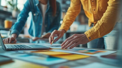 Designers working together on color palette selection for a graphic design project