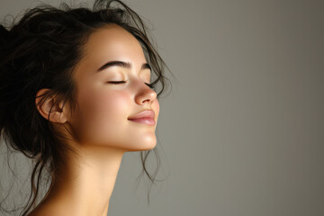 A close up of a girl's face with her eyes closed