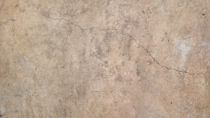 texture of old cracked dirty concrete wall for background in sepia brown color tone. rustic background. bare concrete wall texture with blank space for design.