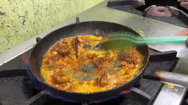 Close up shot of cooking of sukha mutton. A south Indian mutton dish.	