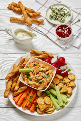 buffalo chicken dip with veggie and bread sticks