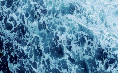 Aerial view to ocean waves. Blue water background