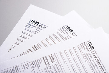 Obraz premium Tax form 1040 forms lying on table close-up, tax concept