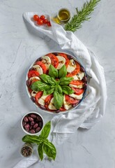 caprese salad with tomatoes and mozzarella flat lay