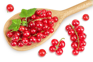 Red currant berries in a wooden spoon with leaf isolated on white background. Top view. Flat lay