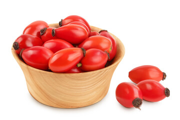 Rose hip in wooden bowl isolated on a white background with full depth of field. Top view. Flat lay.