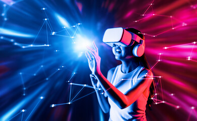 Smart female standing surrounded by neon light wearing VR headset connecting metaverse, future cyberspace community technology. Elegant woman using finger touch virtual reality object. Hallucination.