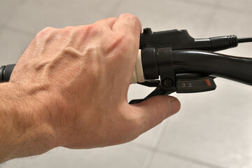 Man holding handle bar of bicycle