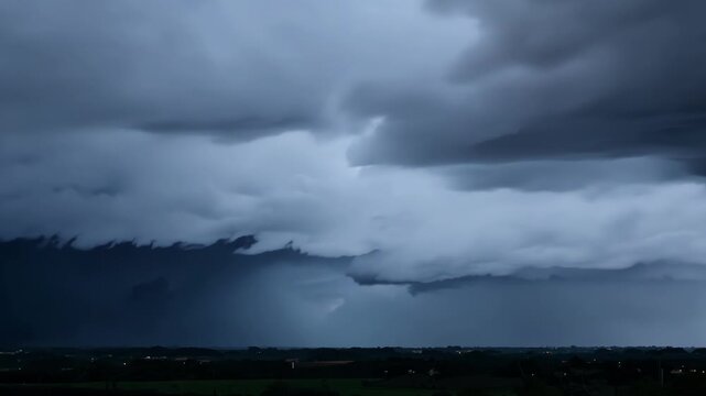 The rumble of thunder echoes through the sky as storm clouds swirl and collide creating an intense dramatic atmosphere.