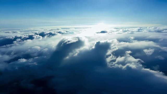 The clear blue sky above stands in stark contrast to the chaotic sea of thunderheads below seen from a vantage point above the storm.