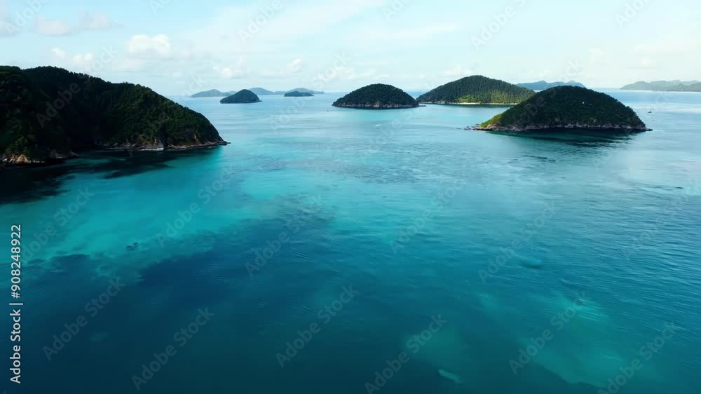 Canvas Prints Crystal clear water surrounds several islands allowing their peaks to reflect off the surface and creating a mirrorlike effect.