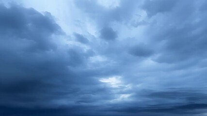 A gradual transition from clear skies to a dark stormy atmosphere as the clouds multiply.