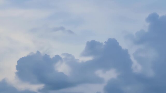 The soft silver glow of wispy clouds creating a dreamy and peaceful atmosphere in the sky.