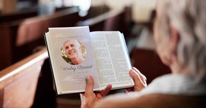 Funeral, church and person with pamphlet and bible for memorial service, sermon and ceremony. Religion, death and sad woman in congregation with obituary for mourning, memory and prayer in chapel