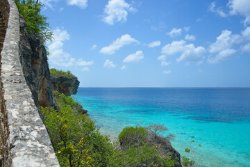 Scenic view of azure blue Caribbean sea and stone staircase in Bonaire, Netherlands Antilles.