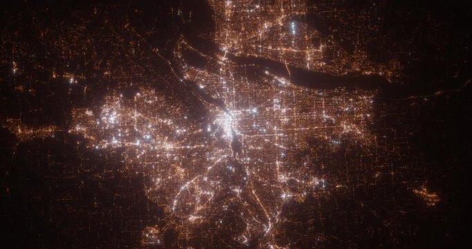 Portland (Oregon, USA) aerial view at night. Top view on modern city with glow effect. Camera is zooming out, rotating counterclockwise