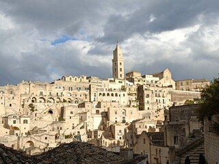 Obraz premium clouds and sun rays over the ancient city of Matera, Italy