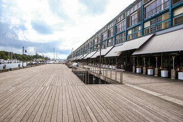 Obraz premium Boardwalk along Finger Wharf, a former passenger terminal turned into a hotel and residential building in Sydney Harbour, New South Wales, Australia