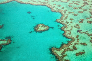 Aerial view of the Heart Reef, a coral reef in the shape of a heart in the Great Barrier Reef, the world's largest coral reef system located in the Coral Sea, off the coast of Queensland, Australia