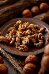 Walnut kernels and whole walnuts on a table.
Image of organic walnuts.
