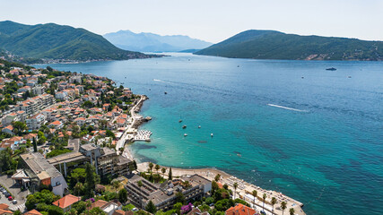 Naklejka premium Aerial view of a waterfront residential area in Herceg Novi on the coast of the Adriatic Sea in the Bay of Kotor in Montenegro