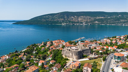 Fototapeta premium Aerial view of the turkish fortress of Kanli Kula in Herceg Novi, a town in located at the western entrance to the Bay of Kotor on the coast of the Adriatic Sea in Montenegro