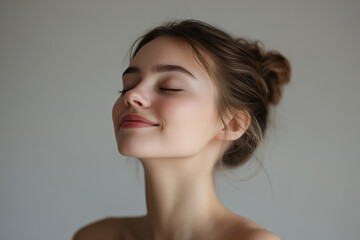 Fototapeta premium A close up of a girl's face with her eyes closed