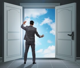 Fototapeta premium Businessman entering big large door