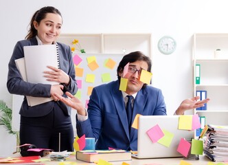 Two colleagues employees working in the office