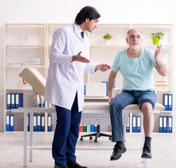 Old man visiting young male doctor