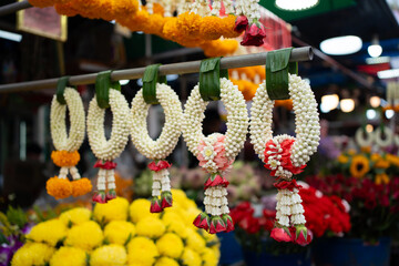 Thai garlands neatly displayed at the market for sell.