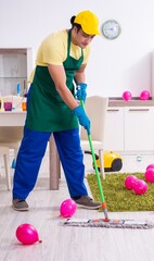 Young male contractor doing housework after party