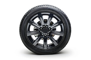 Obraz premium Stylish alloy wheel with intricate black and silver design, ideal for performance vehicles, isolated on a clean white background.