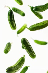 Falling Cucumbers isolated on white background, full depth of field