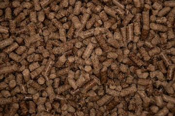 close up wood pellets for wood pellet grill, top view, copy space