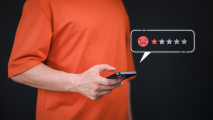 Customer use a phone give angry emotion face on virtual screen for feedback review satisfaction service opinion and testimonial on application. Online customer review satisfaction feedback survey.