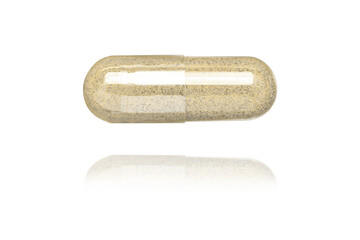 brown medicine capsule on white