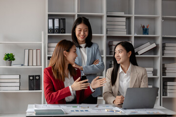 three businessperson are working in the modern office, group of employee has discussion about new project, working as teamwork is more effective, coworkers are brainstorming to planing great strategy