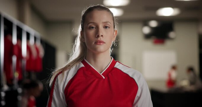 Exercise, confidence and face of woman soccer player in locker room for match, game or tournament. Serious, expression and portrait of young female athlete with challenge, proud and competition