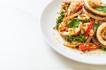 stir fried holy basil with octopus or squid and herb