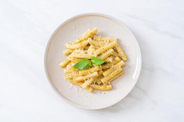 pesto rigatoni pasta with parmesan cheese