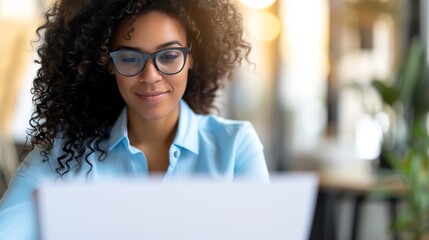 Efficient HR Professional Reviewing Job Applications on Computer | Streamlined Recruitment Process Evaluation