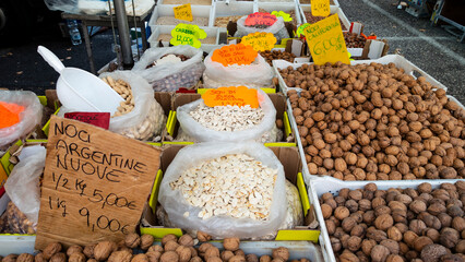 Street market stalls with dried legumes, Rome, Italy